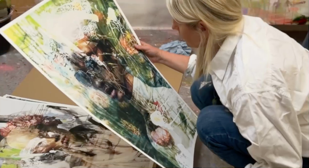 ea bodin looking at her fine art prints in her studio
